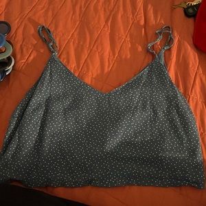 it’s dark blue and cropped and super cute on